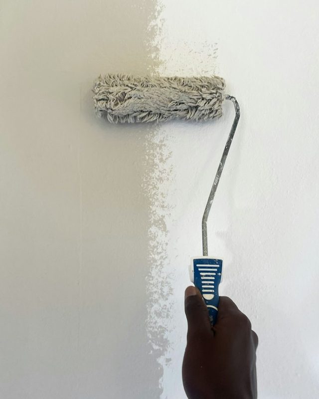 Applying interior coating to a wall